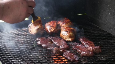 BBQ off the Scottsdale by Arizona BBQ Outfitters. This is a Santa Maria style cooker with a lid that accepts a Cast iron skillet, Cast iron Wok and a cast Iron Griddle. Thin slices beef & Mushroom Stuffed chicken breasts on the scottsdale.