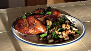 BBQ off the Scottsdale by Arizona BBQ Outfitters. This is a Santa Maria style cooker with a lid that accepts a Cast iron skillet, Cast iron Wok and a cast Iron Griddle. Orange chicken and Garlic Red Potatoes plated up.