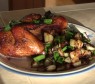 SmokingPit.com - Orange Chicken and Garlic Potatoes cooked over a oak wood fire on the Scottsdale Santa Maria Style grill.