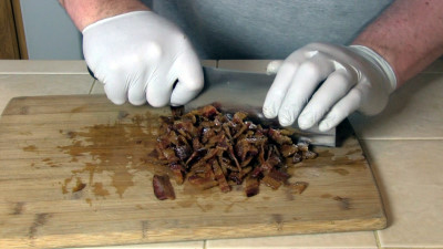 SmokingPit.com - Bacon Cheeseburger Meatloaf slow cooked on a Yoder YS640 Pellet cooker - Chopping Bacon.