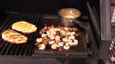 SmokingPit.com -Alaskan King Crab legs & Shrimp on Flat Iron Steaks topped with mushrooms and a Cajun butter sauce. Cookied on the Yoder YS640 smoker & Traeger texas grill. - Cajun Butter Sauce.