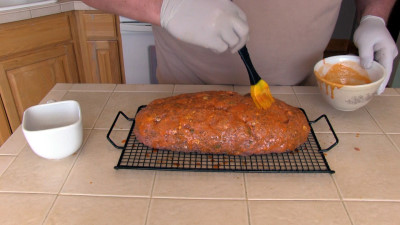 SmokingPit.com - Buffalo Blue Cheese Meatloaf slow cooker on a Yoder YS640 Pellet cooker - Mopping on the Buffalo sauce.