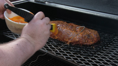 SmokingPit.com - Buffalo Blue Cheese Meatloaf slow cooker on a Yoder YS640 Pellet cooker - Mopping on more Buffalo sauce.