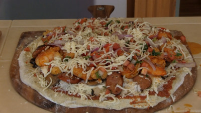 SmokingPit.com - Cajun Seafood Pizza recipe wood fire cooked on my Scottsdale Santa Maria style cooker. The built pizza.
