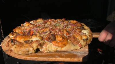 SmokingPit.com - Cajun Seafood Pizza recipe wood fire cooked on my Scottsdale Santa Maria style cooker. Hot off the cooker.