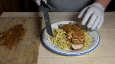 SmokigPit.com - Chicken Fettuccine Marsala Recipe - slow cooked on a Yoder YS640 Pellet smoker. -  slicing the chicken.