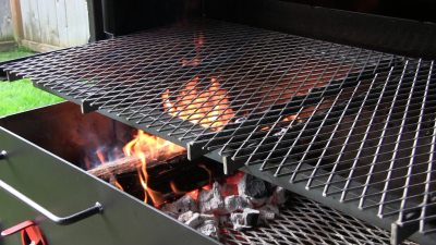 SmokingPit.com - The Colosal Mushroom & Swiss stuffed burger cooked over a oak wood fire on the Scottsdale Santa Maria style pit by Arizona BBQ Outfitters. Building the fire.