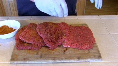 SmokingPit.com - Country Fried Steak & Gravy recipe wood fire cooked on my Scottsdale Santa Maria style cooker. Seasoning the cubed steak.