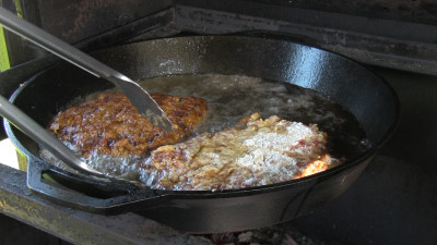 SmokingPit.com - Country Fried Steak & Gravy recipe wood fire cooked on my Scottsdale Santa Maria style cooker. Frying the steak.