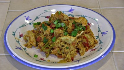 SmokingPit.com - Dutch oven Arroz Con Pollo cooked in a Lodge 12" dutch oven in my Scottsdale Santa Maria style cooker. The Money Shot.