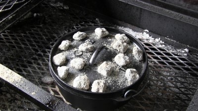 SmokingPit.com - Dutch oven Chocolate Pudding Cake cooked in a Lodge 10" dutch oven in my Scottsdale Santa Maria style cooker. Placing 14 briquettes on top.