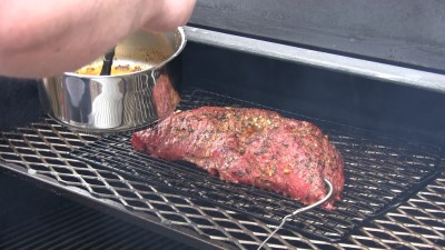 SmokingPit.com BBQ - Crimini Mushrooms, red onion, garlic sauteed in butter injected into a Beef Tri Tip roast. Mopping the garlic butter sauce on the tri tip. 