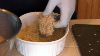 SmokingPit.com - Garlic Parmesan Chicken Tenders slow cooker on a Yoder YS640 Pellet cooker - Coating the tenders.