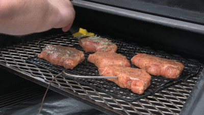 SmokingPit.com - Pork Loin Chops with a Herbed Honey Musterd Sauce.  Slow cooked on a Yoder YS640 Pellet cooker. Basting the chops.