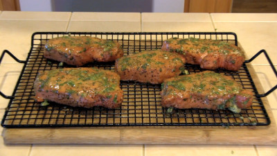 SmokingPit.com - Pork Loin Chops with a Herbed Honey Musterd Sauce.  Slow cooked on a Yoder YS640 Pellet cooker. The chops hot off the cooker.