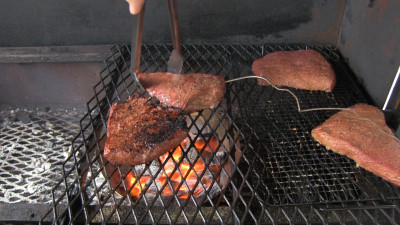 SmokingPit.com - Honey Ginger Flank Steak recipe wood fire cooked on my Scottsdale Santa Maria style cooker. Slow cooking followed by the reverse sear.