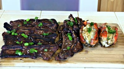 SmokingPit.com - Korean Kalbi BBQ Beef Short Ribs & Lobster Tails in a cajun butter sauce.le Santa Maria style  grill. -  Cooking the bacon.