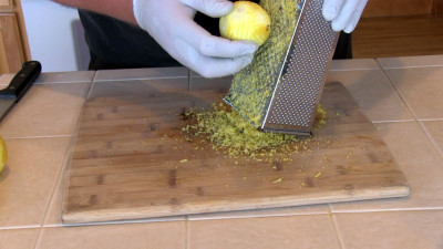 SmokingPit.com - Lemon Rosemary Chicken slow cooker on a Yoder YS640 Pellet cooker - Grating the lemon zest.
