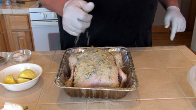SmokingPit.com - Lemon Rosemary Chicken slow cooker on a Yoder YS640 Pellet cooker - Squeezing on some lemon juice.