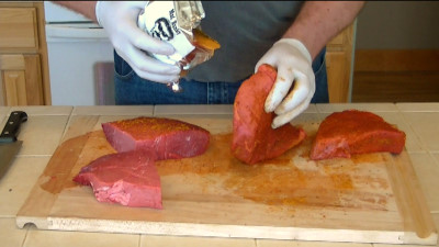 SmokingPit.com - Mesquite & Hickory Smoked Top Round Steak with Sauteed Mushrooms & Shrimp London Broil how to smoke cook videos on  slow cooking on the Yoder YS640 smoker & Traeger texas grill. - Seasoning the meat.