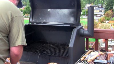 SmokingPit.com - Sugar Maple smoked Mad Hunky Brined Turkey on a Yoder YS640 pellet smoker. loading the smoker.