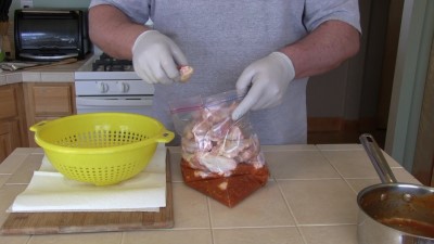 SmokingPit.com - Mad Hunky Italian Hot Wings. Slow cooked on the yoder YS640. Marinating the chicken wings.