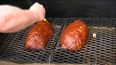 SmokingPit.com - Hickory Smoked Mad Hunky Meatloaf  -  Smoked low and slow on a Yoder YS640 smoker grill. Mouth watering moist, wood fire cooked! Mopping the meatloaf - Tacoma WA Washington 