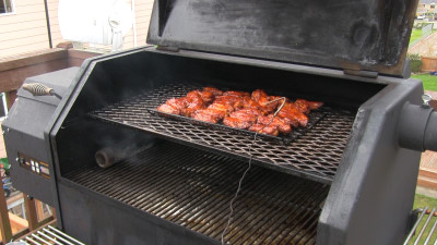 SmokingPit.com - Mad Hunky Tiger Sauce Hot Wings.  Slow cooked on the yoder YS640. Slow cooking the wings.