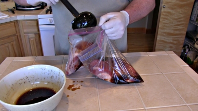 SmokingPit.com BBQ - Sweet Sesame & Soy Marinated Tri-Tip Roast Beef  -  Slow smoked on a Yoder YS640 - Applying the marinade.