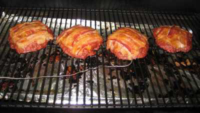 SmokingPit.com - Mesquite Smoked Canadian Bacon & Gouda cheese stuffed Colossal burgers  - Smoked low and slow on a Traeger Texas smoker grill. Sausage ground beef Pinaeapple -   wood fire cooked foods! Tacoma WA Washington 