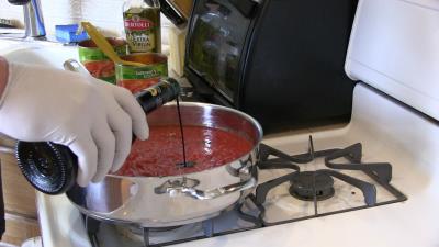 SmokingPit.com BBQ - Signature Apple Smoked Meatball Sub with a fresh tangy marinara. Making marinara.