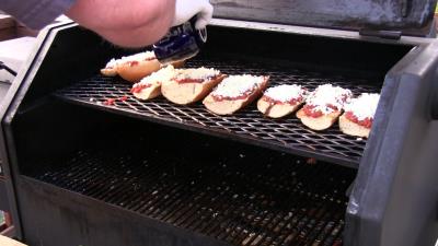 SmokingPit.com BBQ - Signature Apple Smoked Meatball Sub with a fresh tangy marinara. Adding cheese.