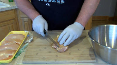 SmokingPit.com - Spicy Parmesan Chicken Tenders slow cooker on a Yoder YS640 Pellet cooker - Slicing the tenders.