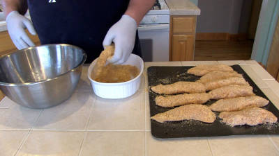 SmokingPit.com - Spicy Parmesan Chicken Tenders slow cooker on a Yoder YS640 Pellet cooker - Coating the tenders.