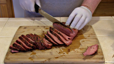 SmokigPit.com - Beef Tri Tip Marsala Recipe - slow cooked on a Yoder YS640 Pellet smoker. - Slicing the Tri Tip roast.