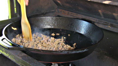 SmokingPit.com - Turkey Sausage Quesadilla recipe wood fire cooked on my Scottsdale Santa Maria style cooker. Frying the turkey sausage..