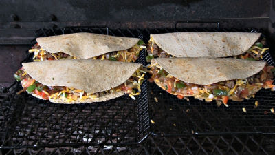 SmokingPit.com - Turkey Sausage Quesadilla recipe wood fire cooked on my Scottsdale Santa Maria style cooker. Into the Scottsdale cooker for some smoke and heat..