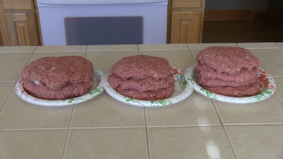 SmokingPit.com - Zesty Italian Onion burgers grilled over an Oak wood fire on the Scottsdale Santa Maria style cooker. Making the patties.