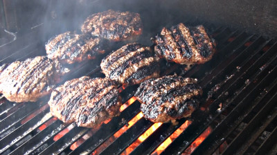 SmokingPit.com - Zesty Italian Onion burgers grilled over an Oak wood fire on the Scottsdale Santa Maria style cooker. Grilling over an oak wood fire.