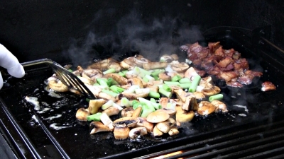 SmokingPit.com - Cajun Shrimp & Bay Scallops with a cajun butter sauce and mushrooms. Griddle cooked on a Yoder YS640 Pellet grill.Saute the veggies.