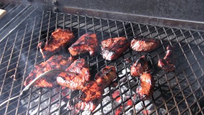 SmokingPit.com - Grilled Sesame Soy Tri Tip slow cooked on a Scottsdale Santa Maria style  grill. Grilling the steak.