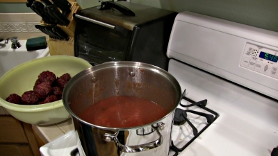 SmokingPit.com - Apple Wood Smoked Italian Meatballs in an authentic San Marzano Tomato Sauce. Smoked on a Yoder YS640. -  Stirring in the meatballs.