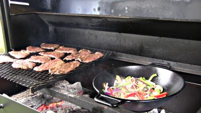 SmokingPit.com - Sesame Soy thin  sliced Beef Bottom Round Steak with a shrimp stirfry. Beef is cooked on a Santa Maria style  grill. Stir fry is done on a Wok in the grill. -  Grill & Wok action on the Scottsdale.